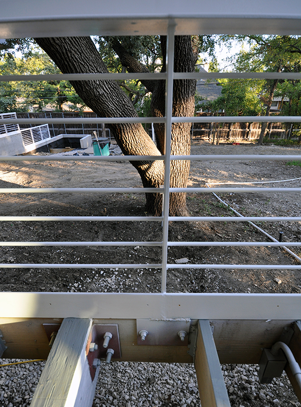 Metal handrail attached to deck