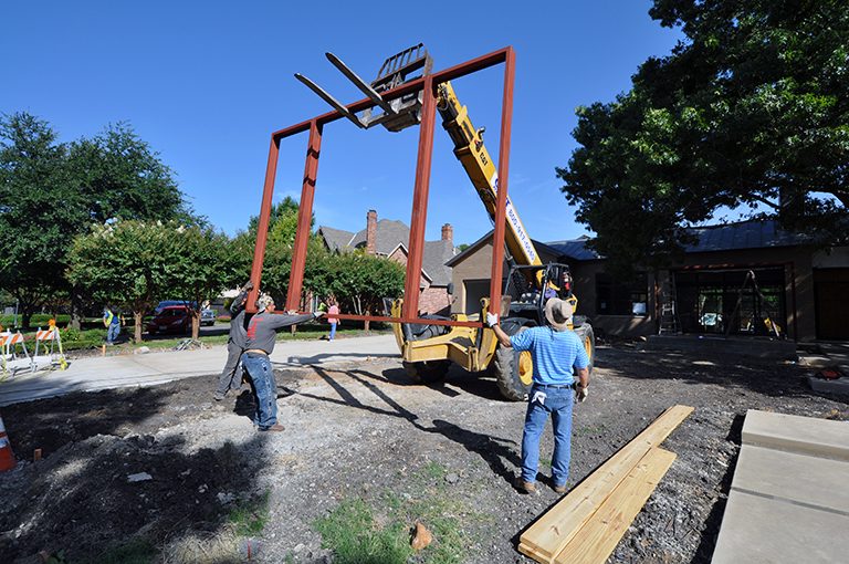 moving the top of the trellis into position