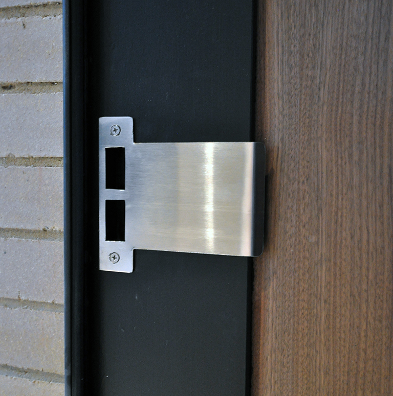 off center pivot door - custom strike plate