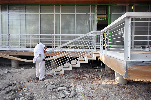 Prepping a metal handrail for painting