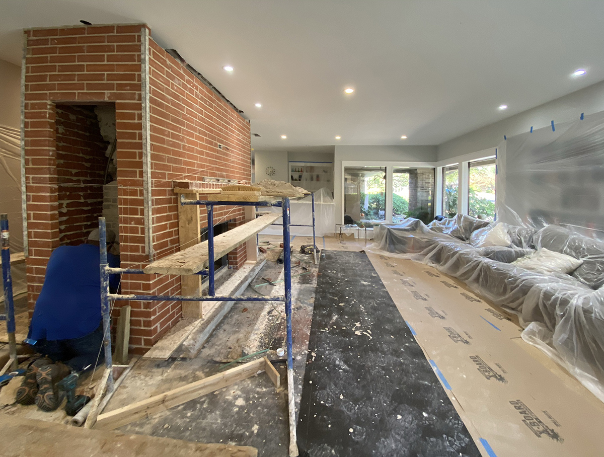 setting the cabinet in the fireplace mass