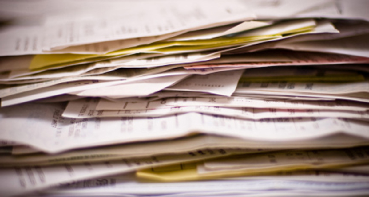 Stack of invoices - Residential Architecture 101: Architectural Fees